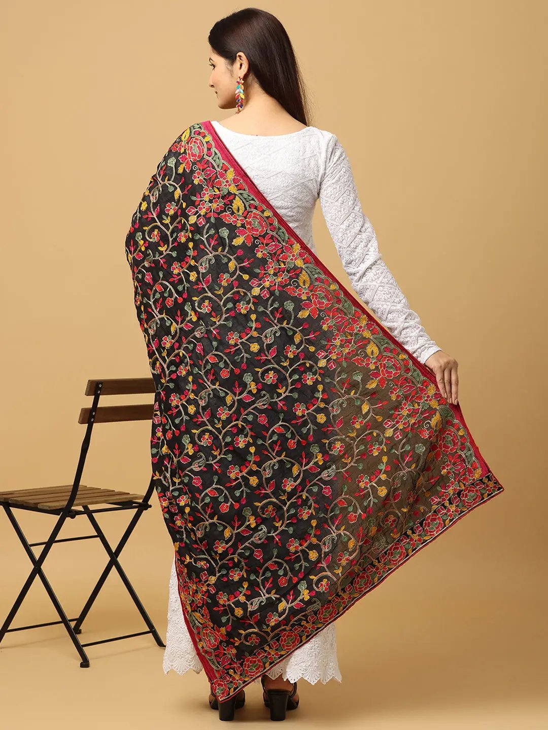 Back view of black poly chiffon dupatta with colorful embroidery.