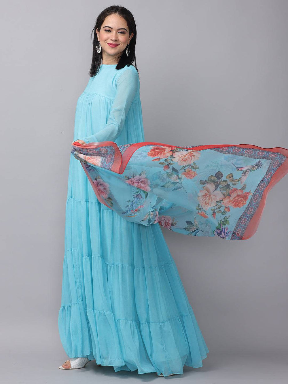 Flowing powder blue dress with floral dupatta, side pose