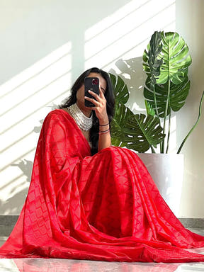 Red georgette saree with elegant thread weaving design