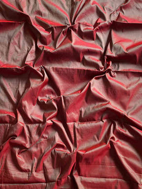 Fabric texture of pink Paithani saree with zari weaving