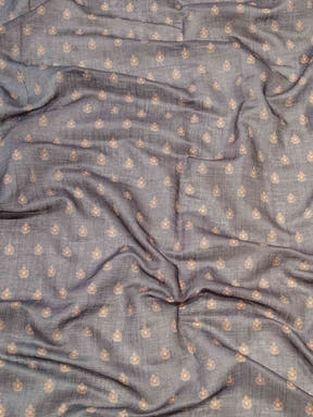 Close-up of grey linen saree fabric with digital print