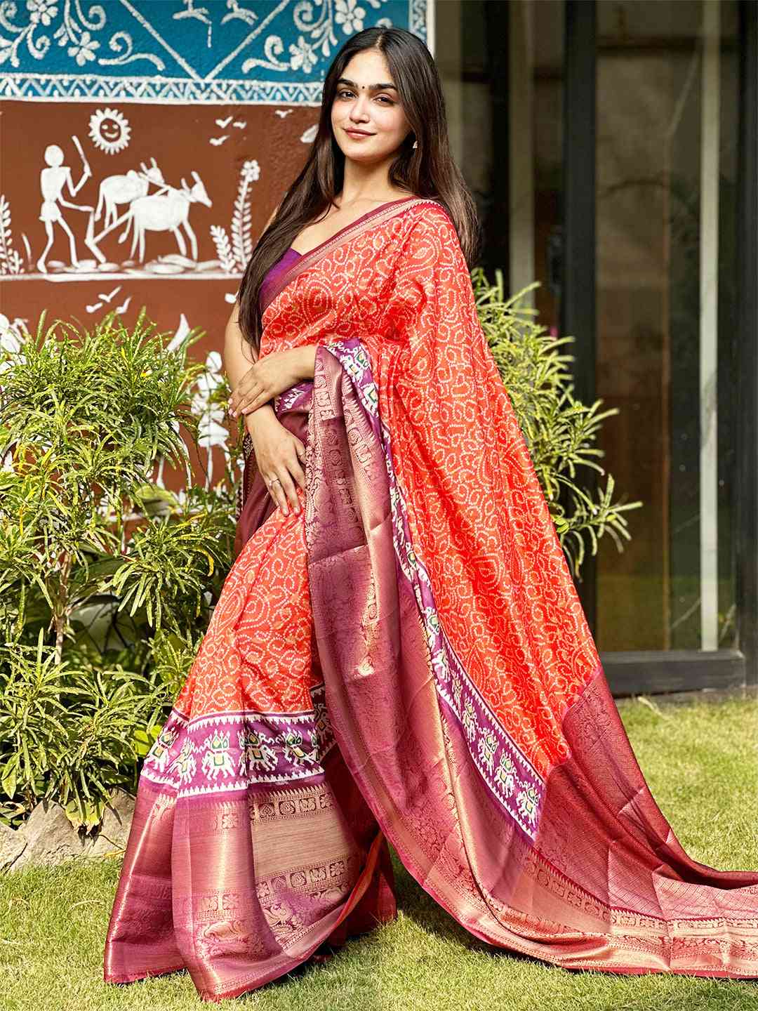 Beautiful orange Bandhej silk saree with detailed Pattu Zari border