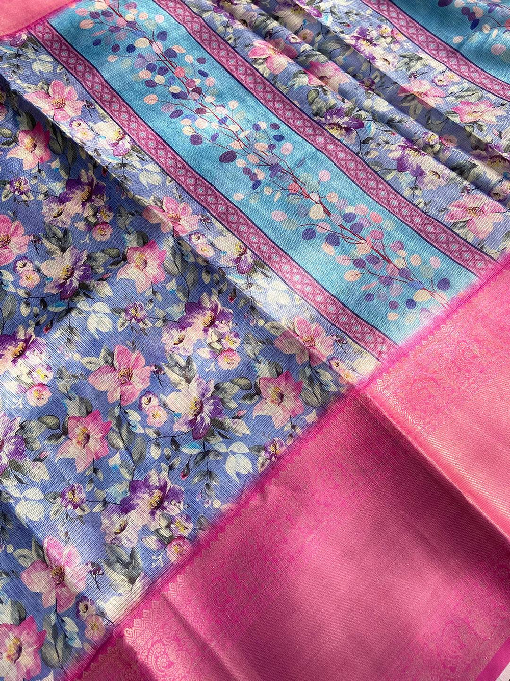 Close-up of Blue Kota Doriya saree with floral design and pink border