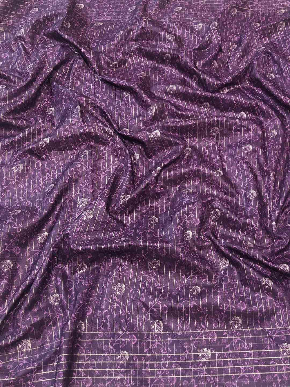 Rich purple fabric with intricate patterns for Kalamkari saree.