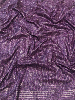 Rich purple fabric with intricate patterns for Kalamkari saree.