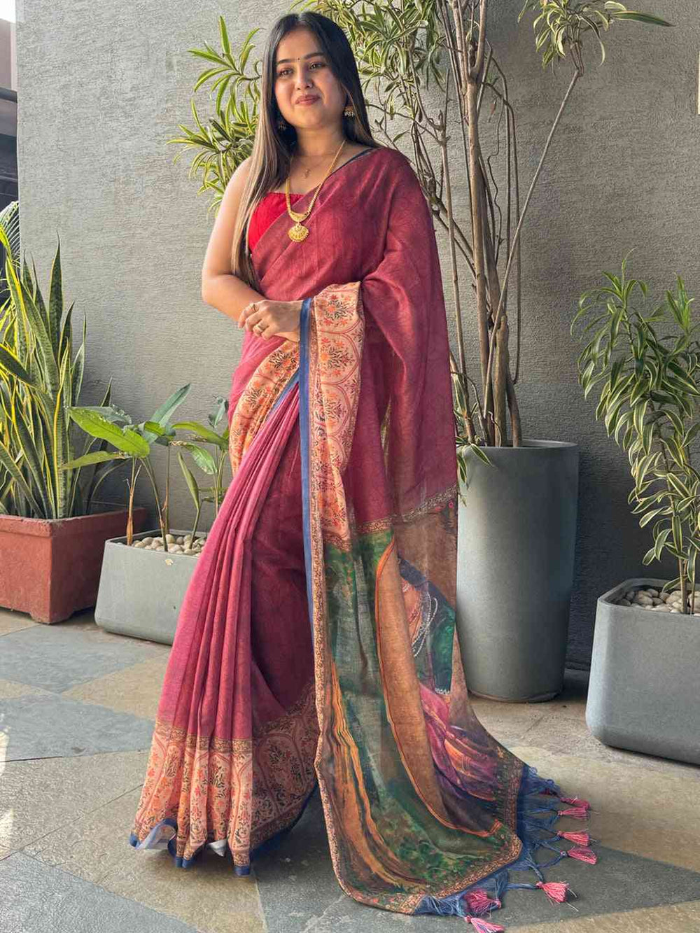 Burgundy Ikkat saree with kalamkari design, standing pose