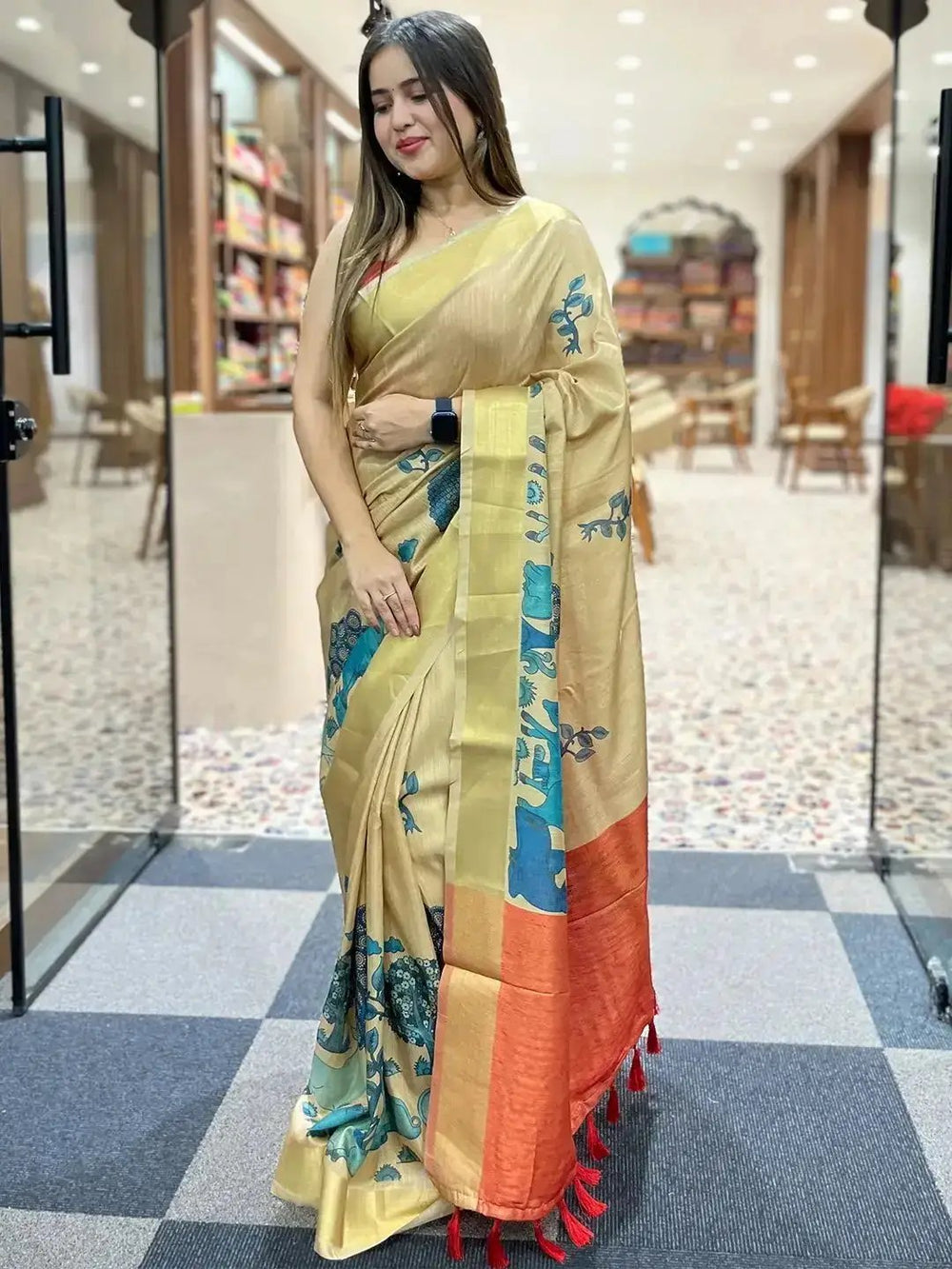 Stylish Kalamkari saree in linen tissue with vibrant patterns.