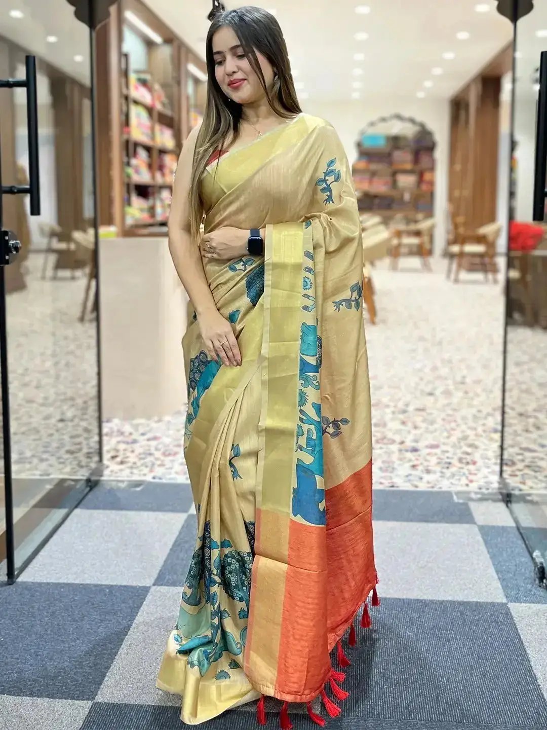 Stylish Kalamkari saree in linen tissue with vibrant patterns.