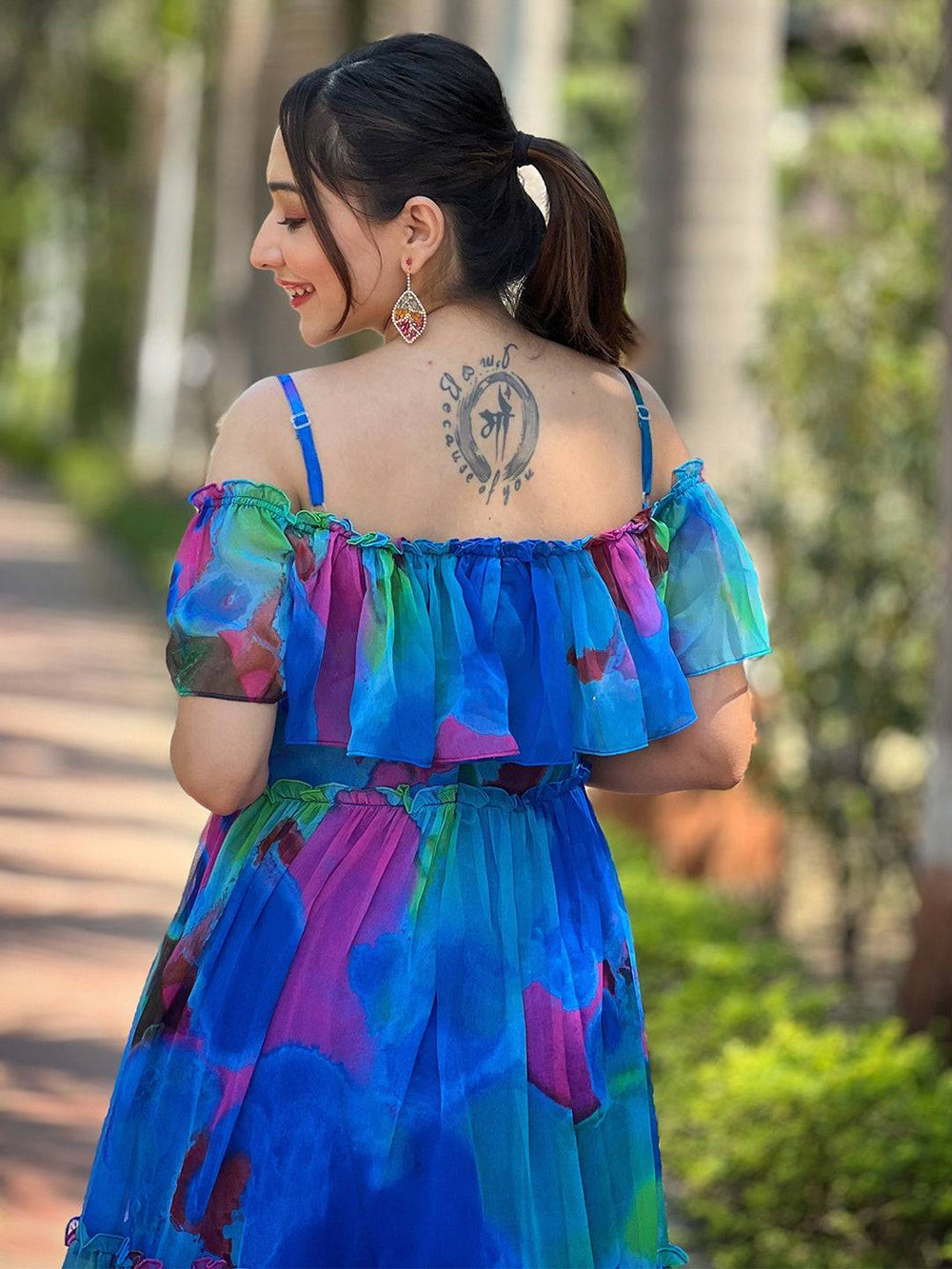 Back view of Persian Blue Abstract Print Dress and tattoo