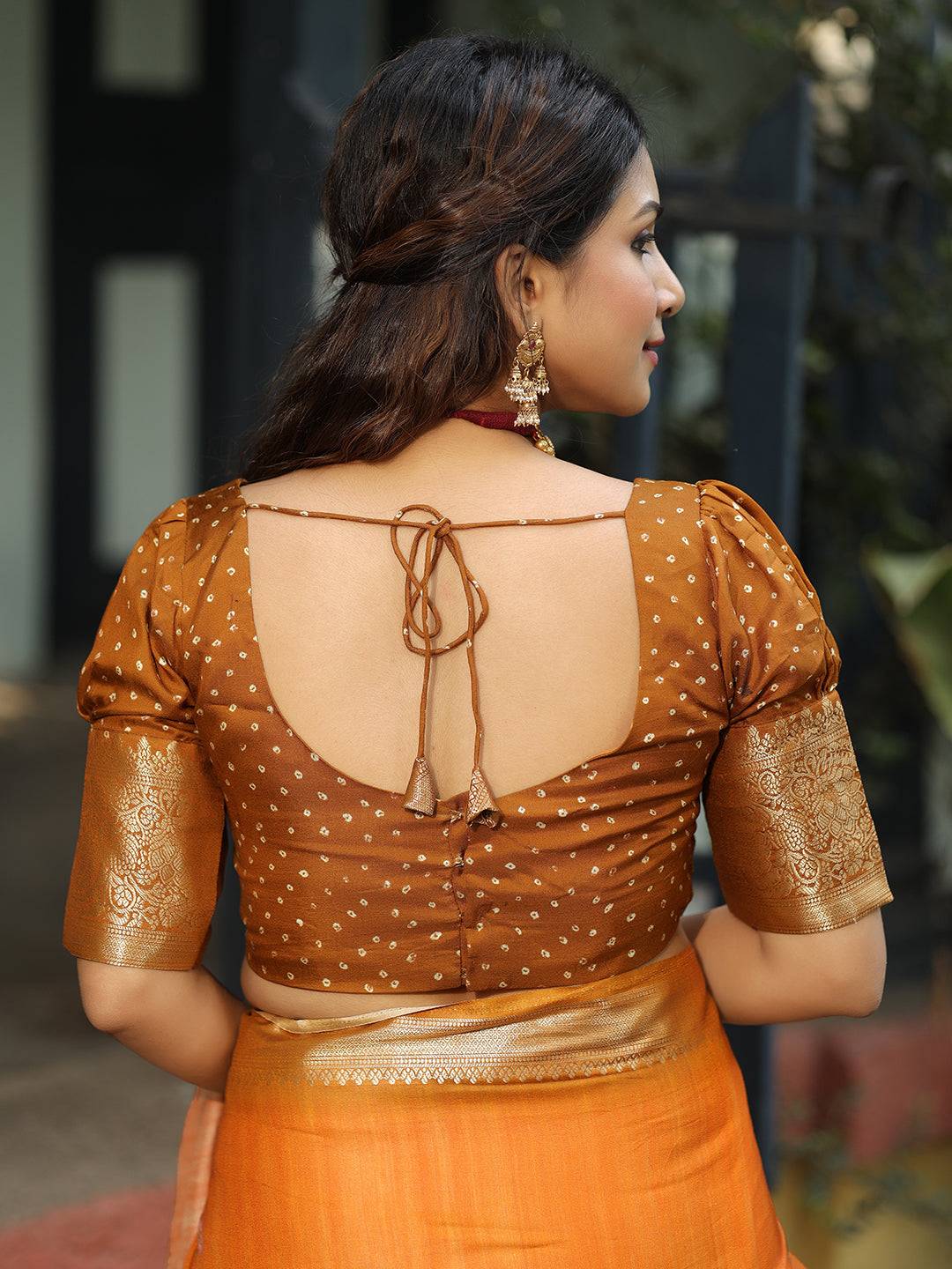 Viscose Dola Silk Orange Saree with Floral and Mughal Print