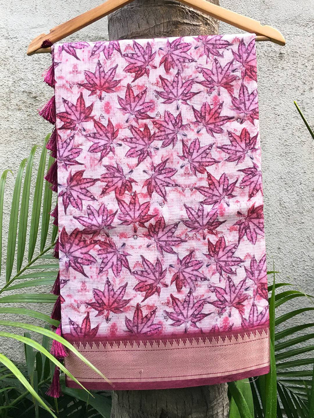 Kanjivaram light pink saree with gold zari pattu border and leaf print