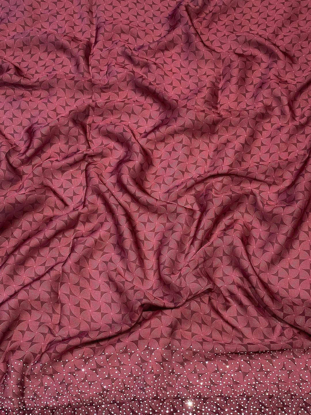 Close-up of satin georgette fabric with intricate design