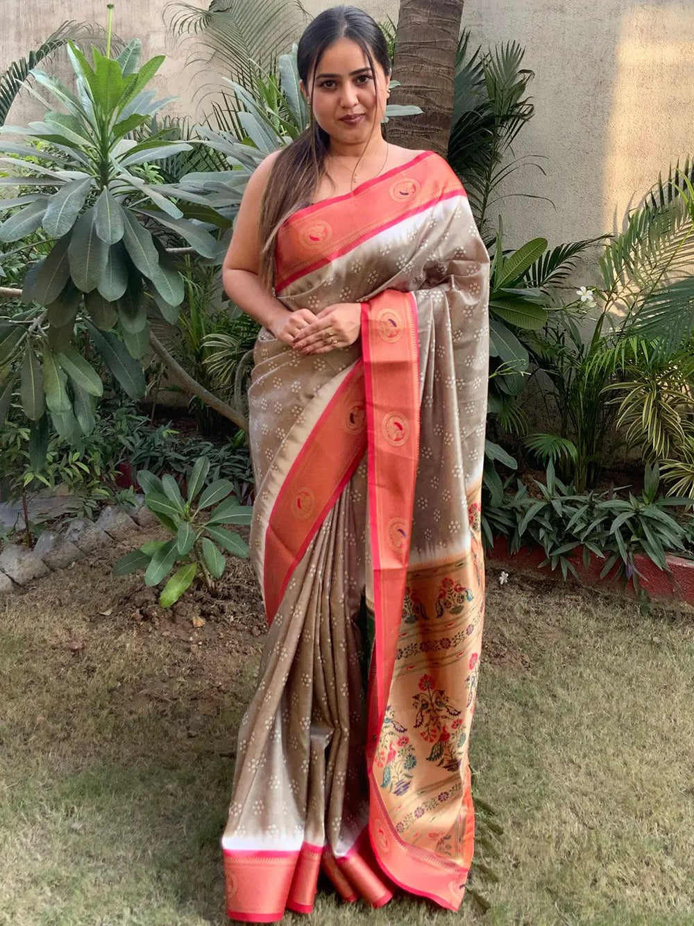 Model showcasing Paithani Bandhej saree with Minakari pallu