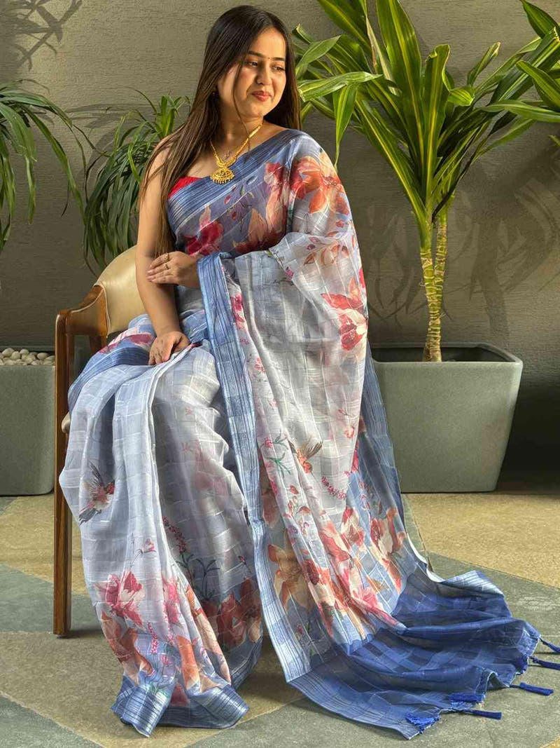 Blue traditional floral print saree with zari chex design.