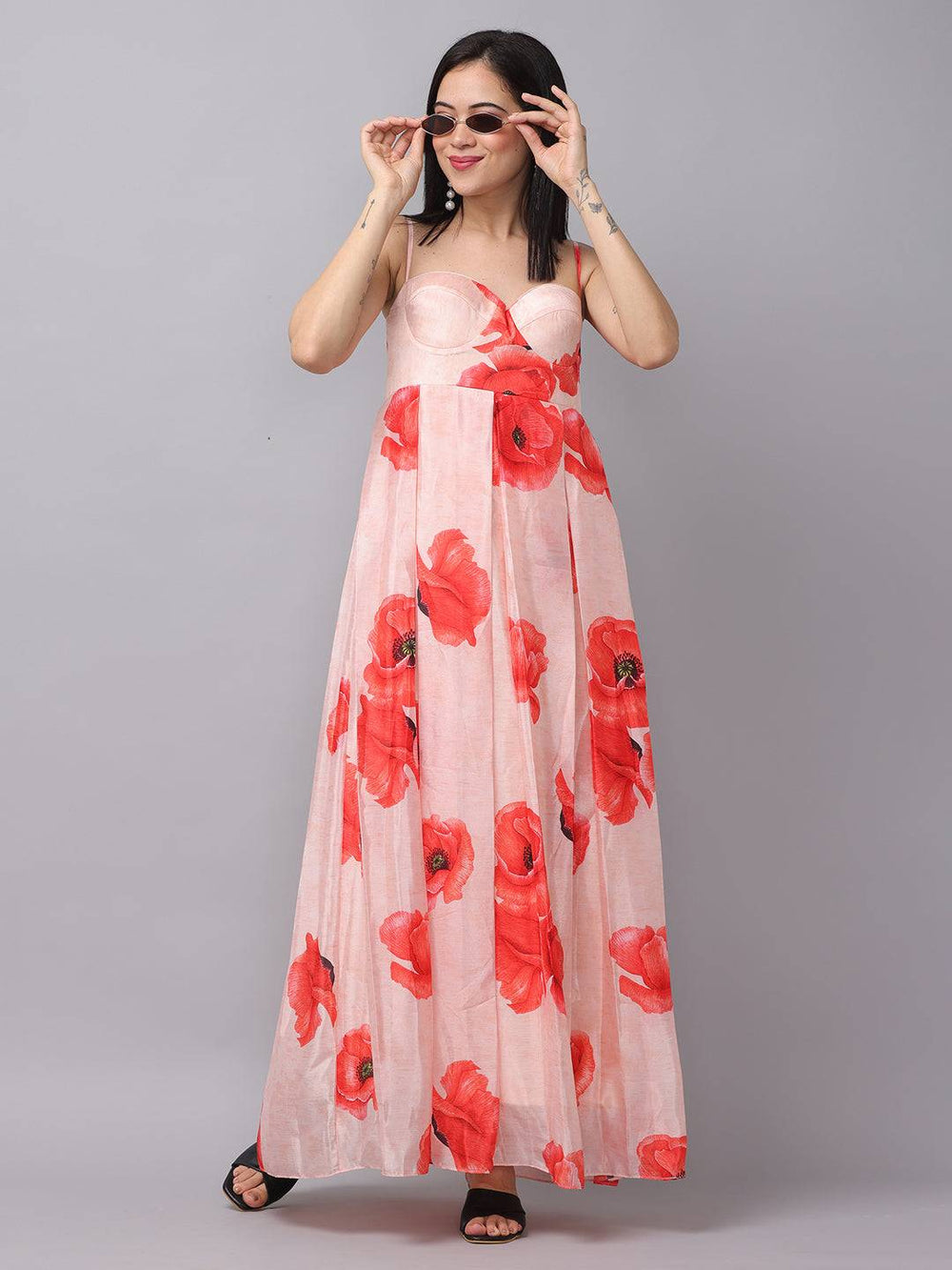 Blush pink dress with red floral print, model in sunglasses