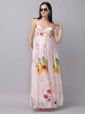 Model in floral chiffon dress with sunglasses, hand on hip