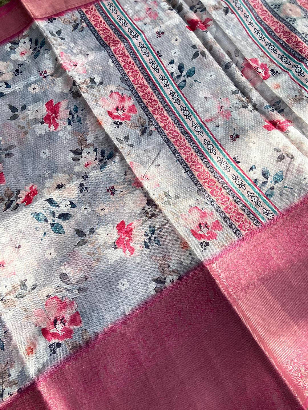 Detailed view of Grey Kota Doriya saree with floral print and pink border