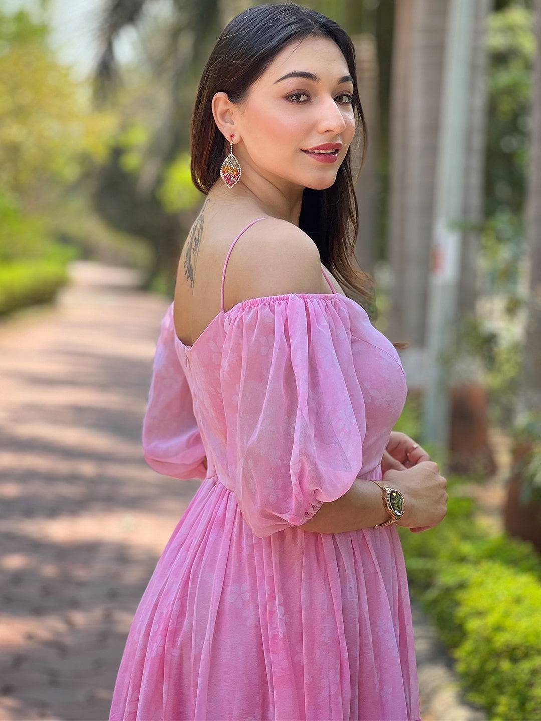 Side view of rose pink floral dress with puff sleeves