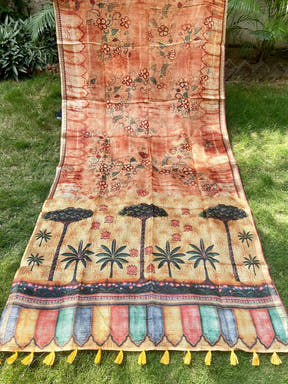 Orange Kota Doriya silk saree with floral and tree motifs spread out.