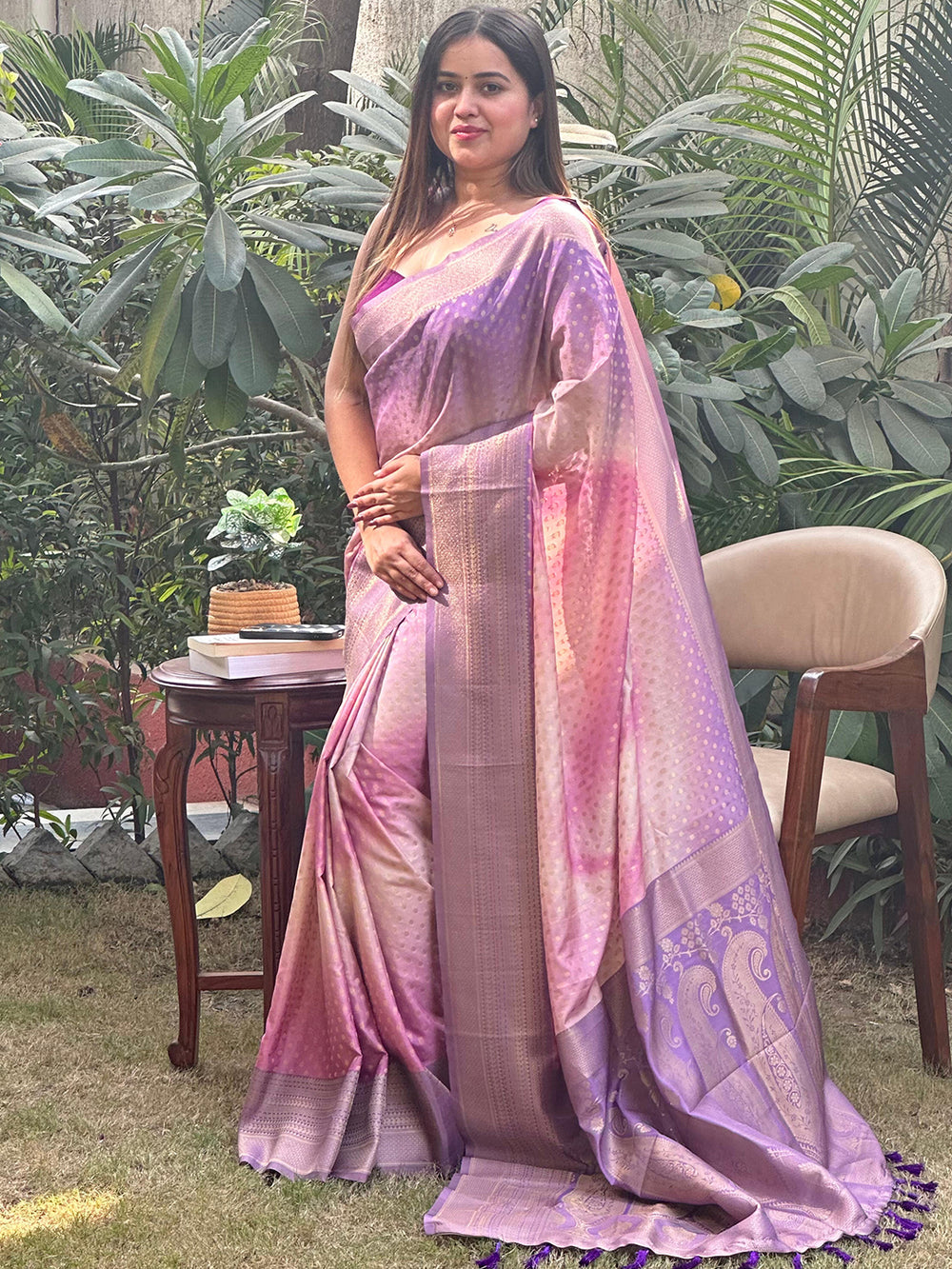 Model wearing violet ombre Banarasi saree in garden