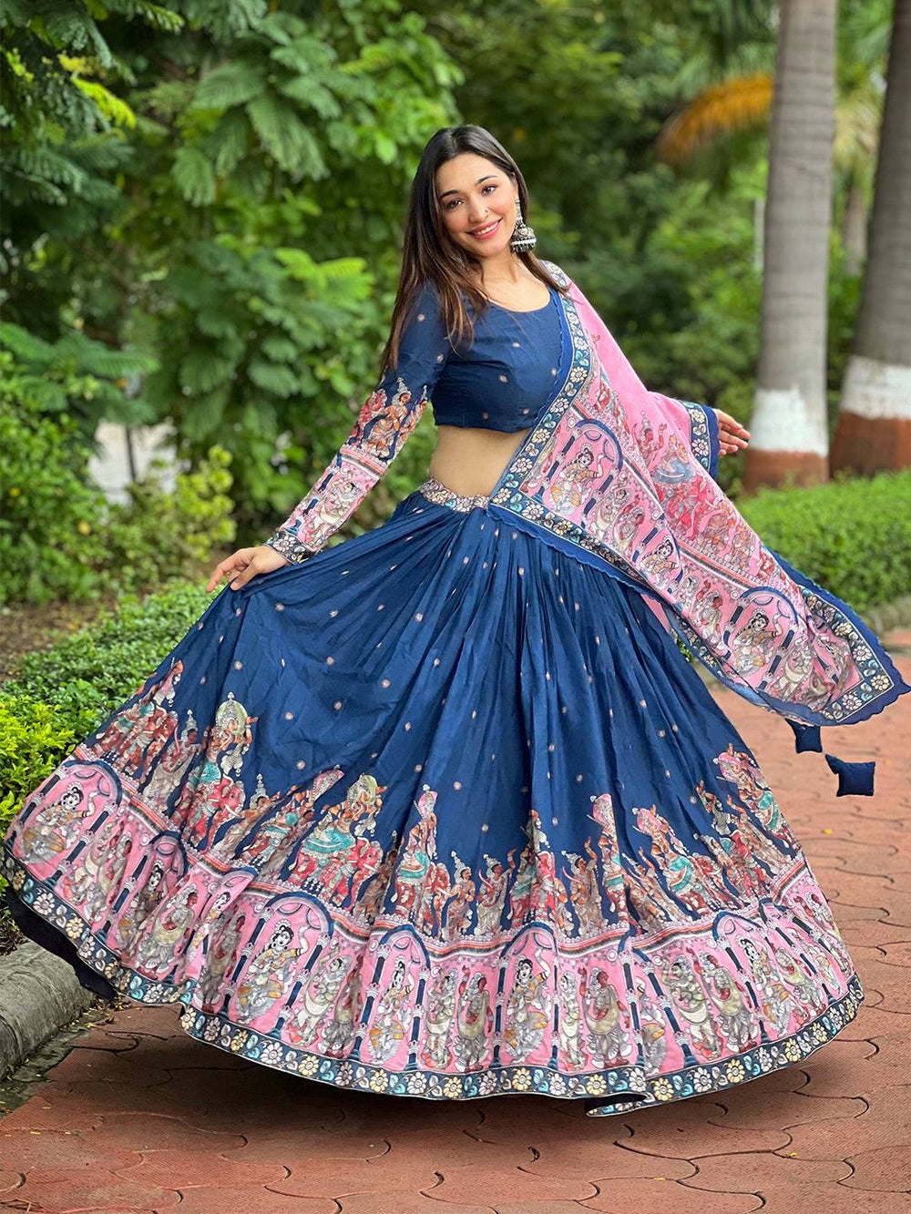 Admiral Blue Kalamkari Lehenga twirling in garden