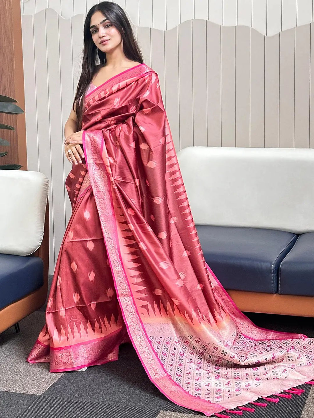 Elegant soft silk Banarasi saree with zari patola pallu draped.
