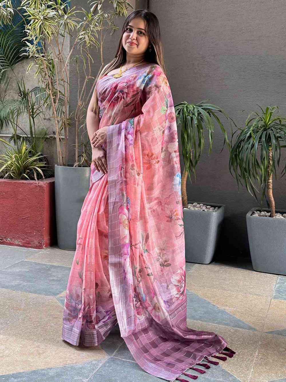 Stylish pink floral print saree with self zari chex