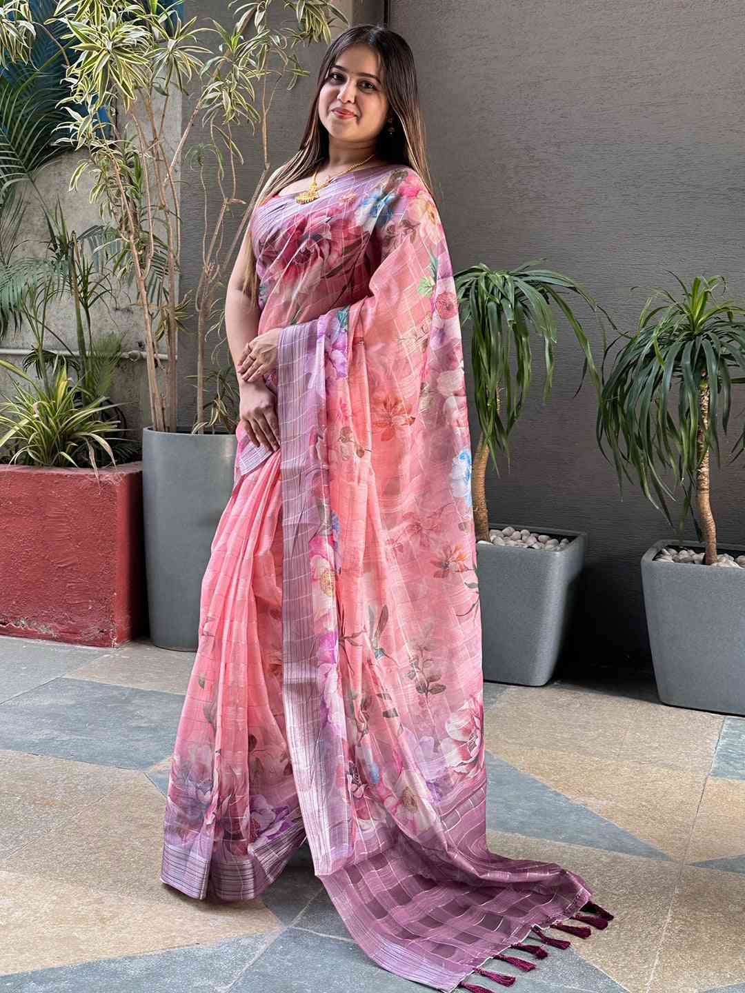 Stylish pink floral print saree with self zari chex