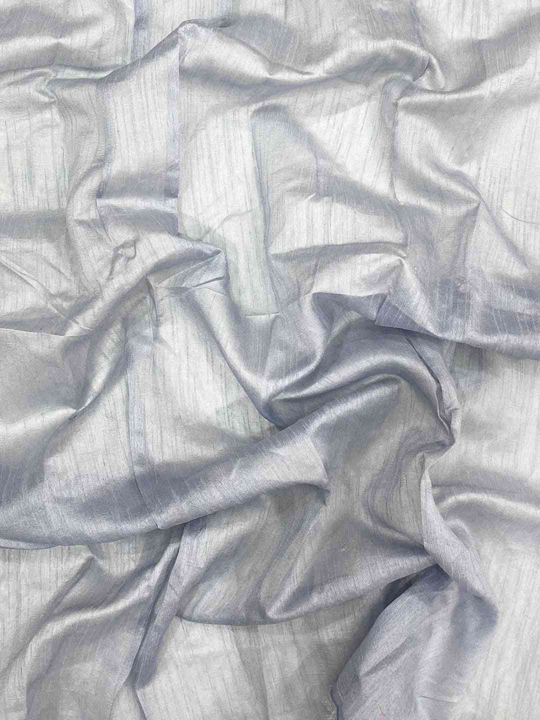 Close-up of delicate net fabric with subtle sheen.