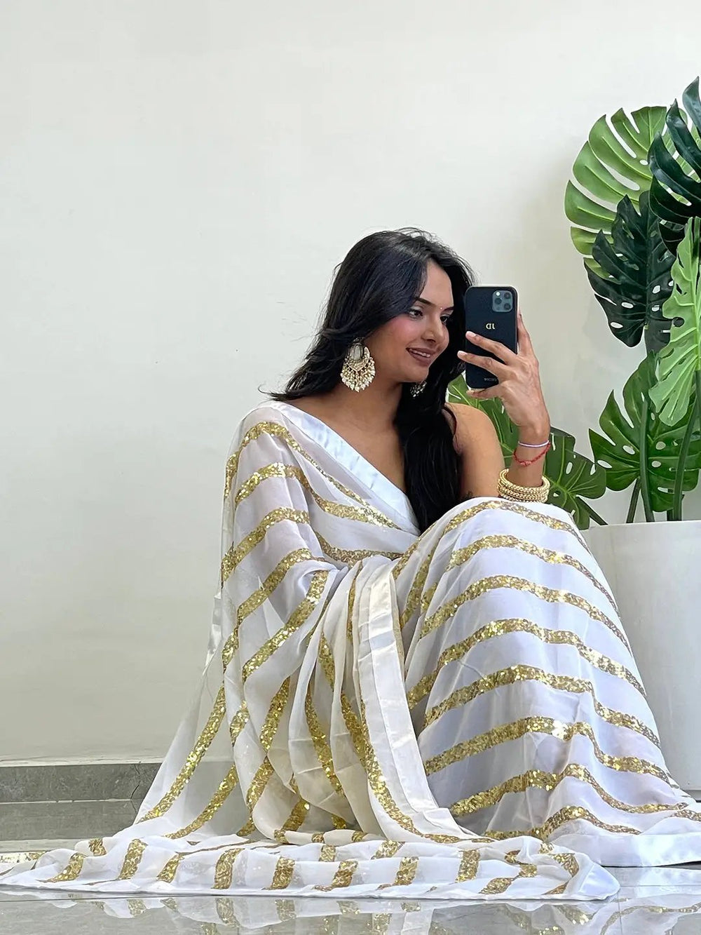 Chic georgette saree with gold sequins and solid border