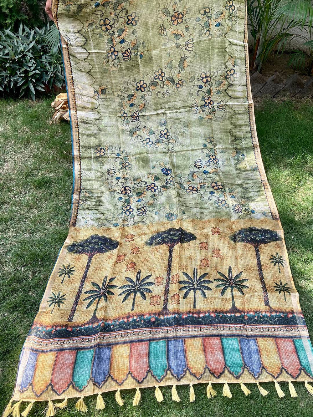 Full view of light green Kota Doriya silk saree with floral and palm design