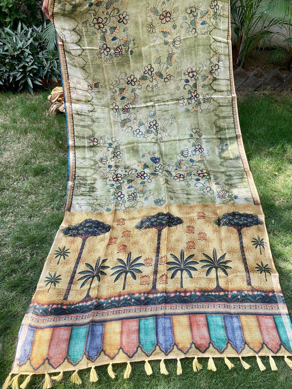 Full view of light green Kota Doriya silk saree with floral and palm design