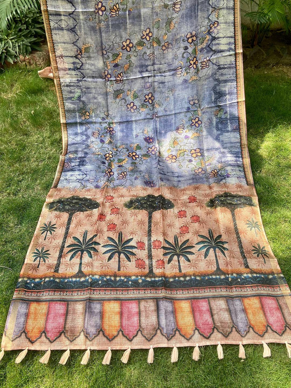 Full view of blue Kota Doriya silk saree with floral and tree motifs.