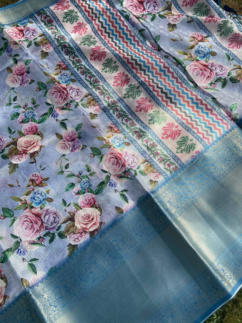 Close-up of floral print on lavender saree with gold zari border