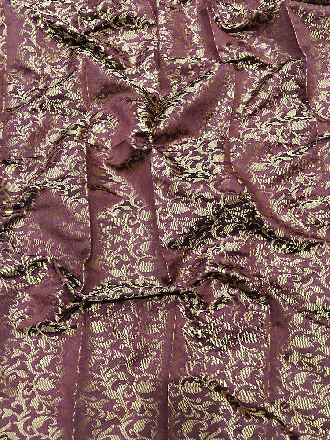 Close-up of gold and maroon Kanjivaram saree fabric