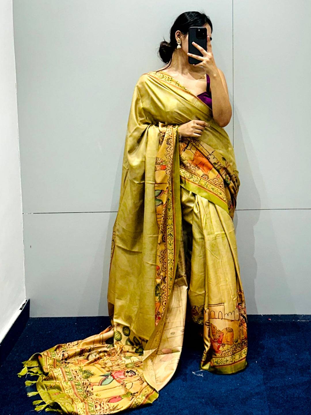 Stylish light green Kalamkari saree with detailed artwork