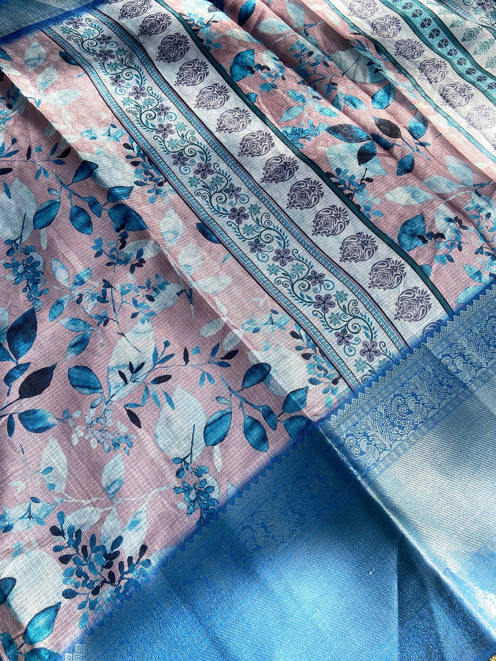 Close-up of Muvel Kota Doriya saree with intricate floral and paisley patterns