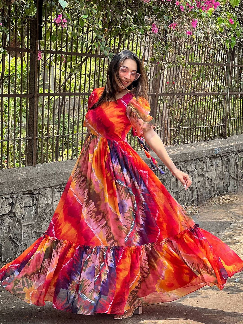 Colorful batik bandhej dress twirling outdoors