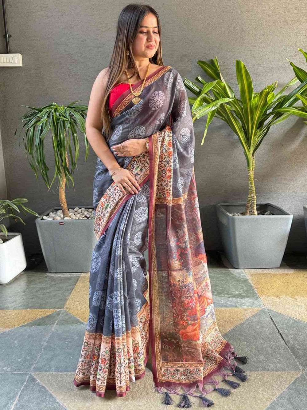 Stylish grey saree with Kalamkari print and tassel details