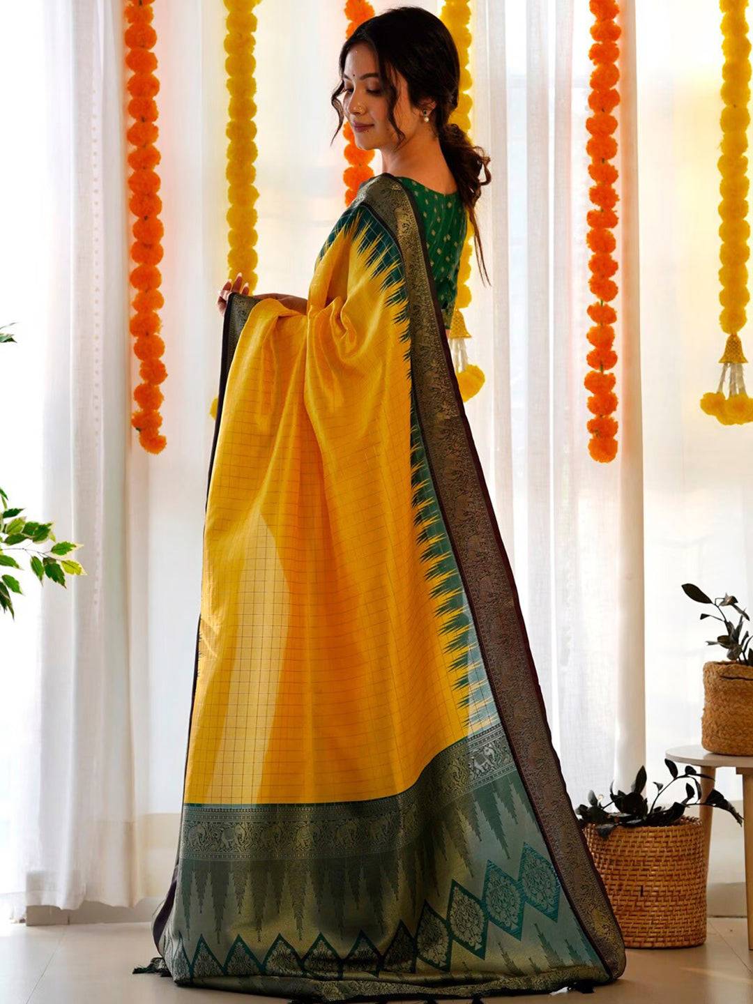 Side view of yellow Banarasi silk Gadwal saree with intricate zari.