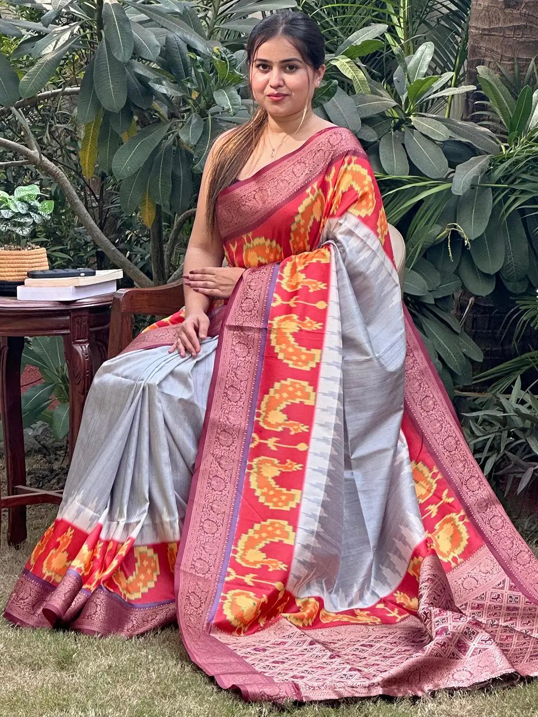 Charming Banarasi soft silk saree with detailed zari patola pallu