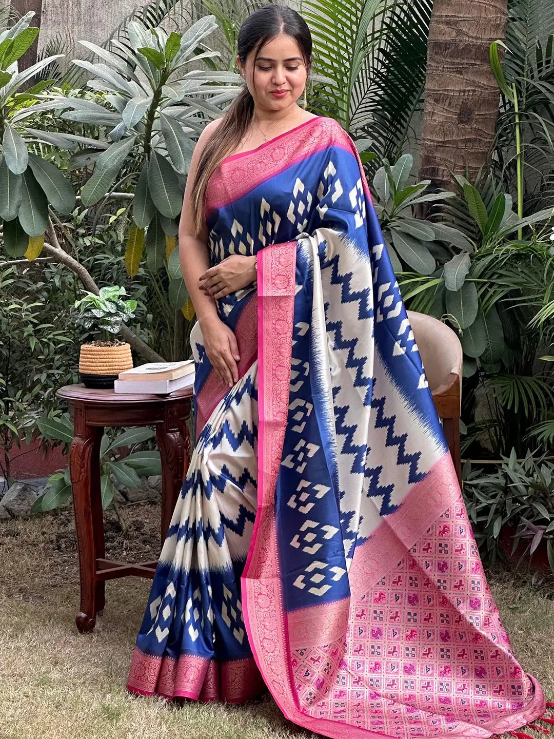 Elegant Banarasi saree featuring intricate Zari Patola design