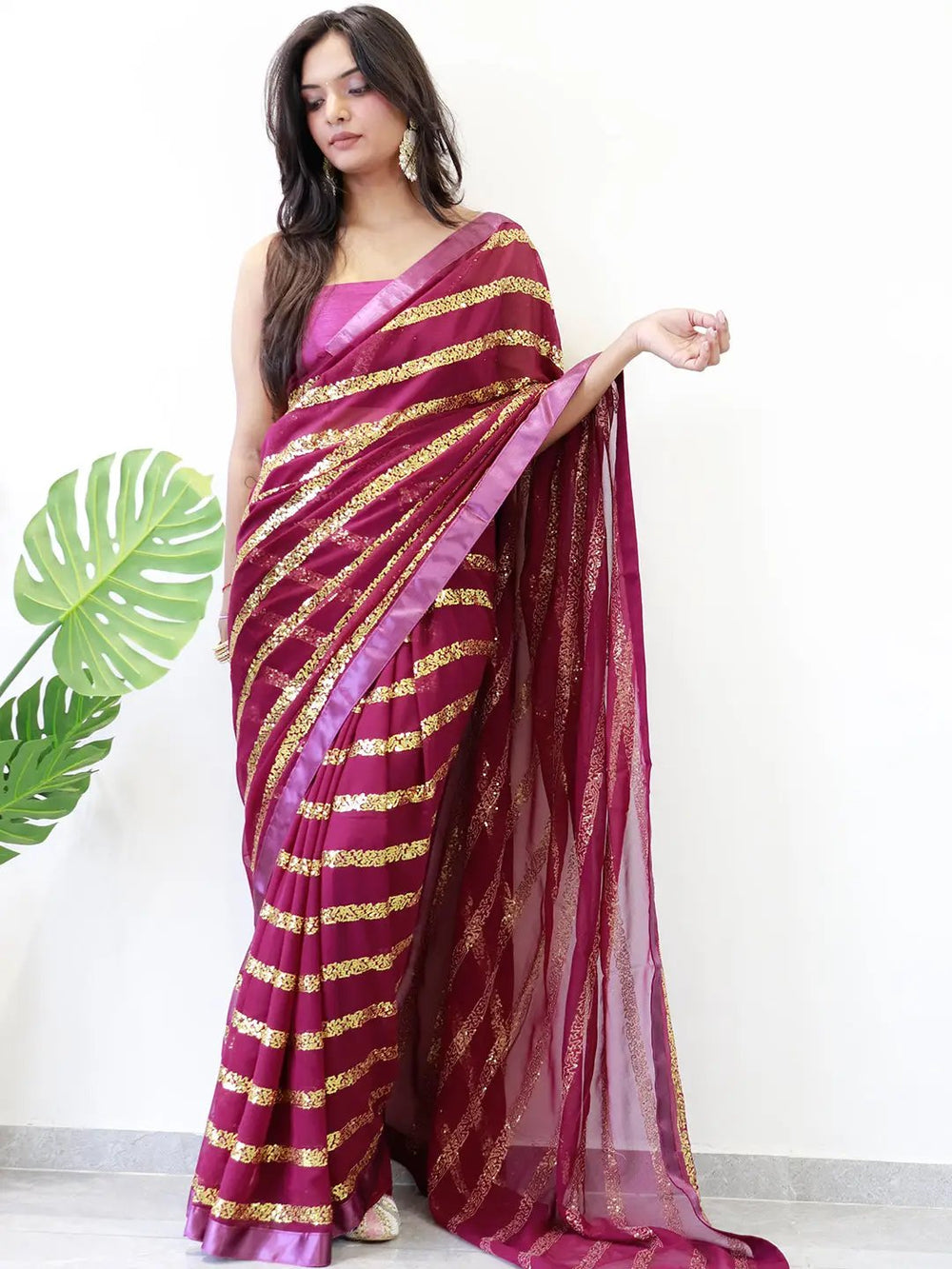 Modern elegance georgette saree with striped sequins work