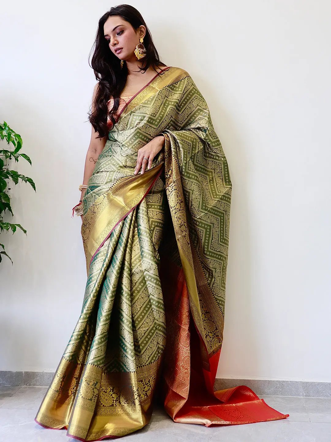 Luxurious Kanjivaaram pattu silk saree featuring gold zari work.