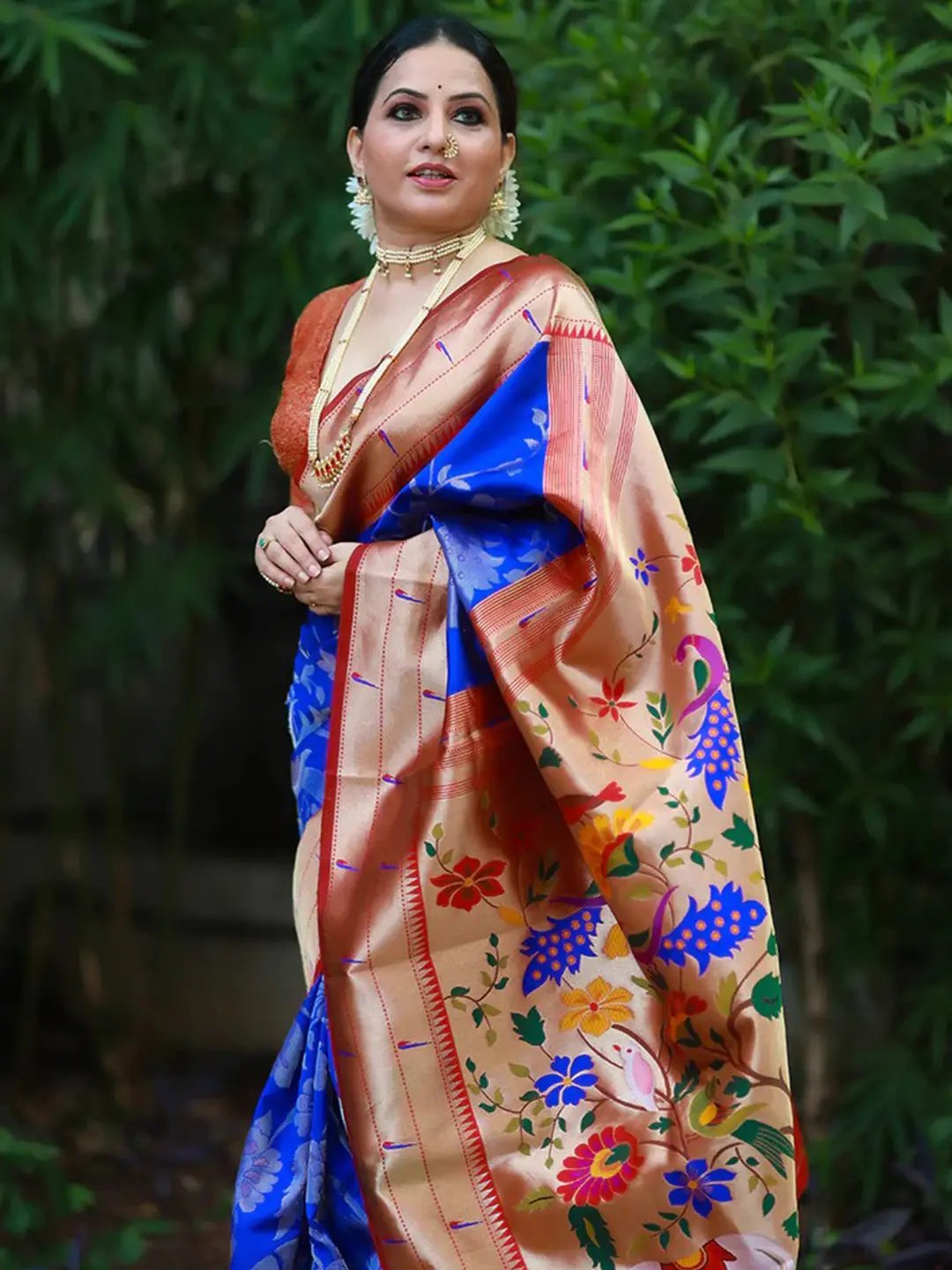 Traditional royal blue Paithani silk saree with vibrant pallu