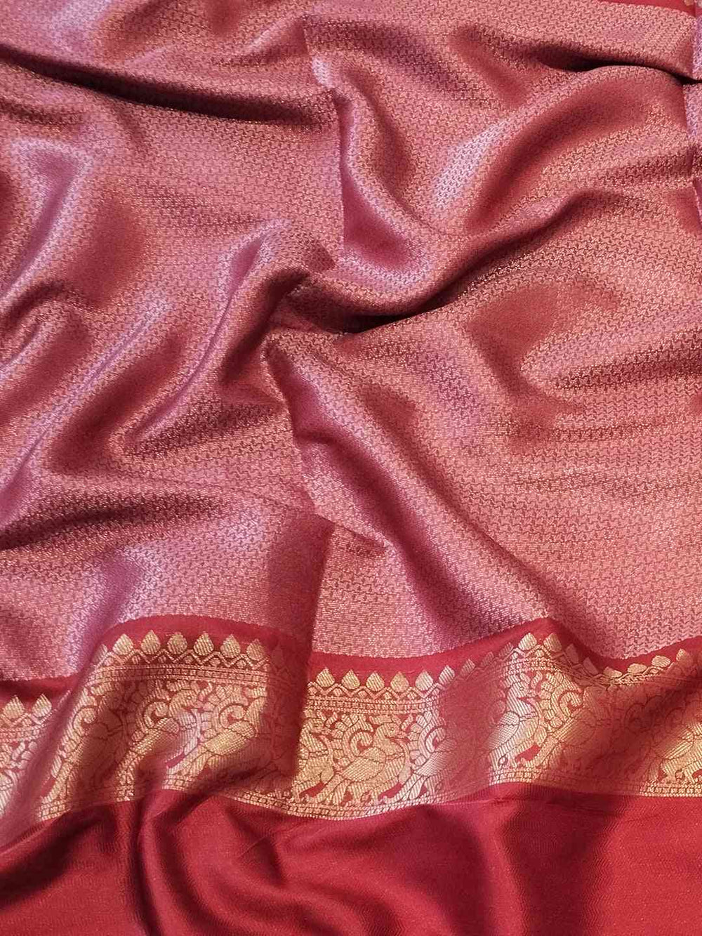 Rich red Banarasi silk fabric with golden border detail
