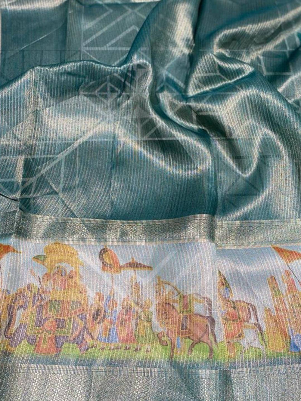 Close-up of digital print on soft gold zari tissue saree
