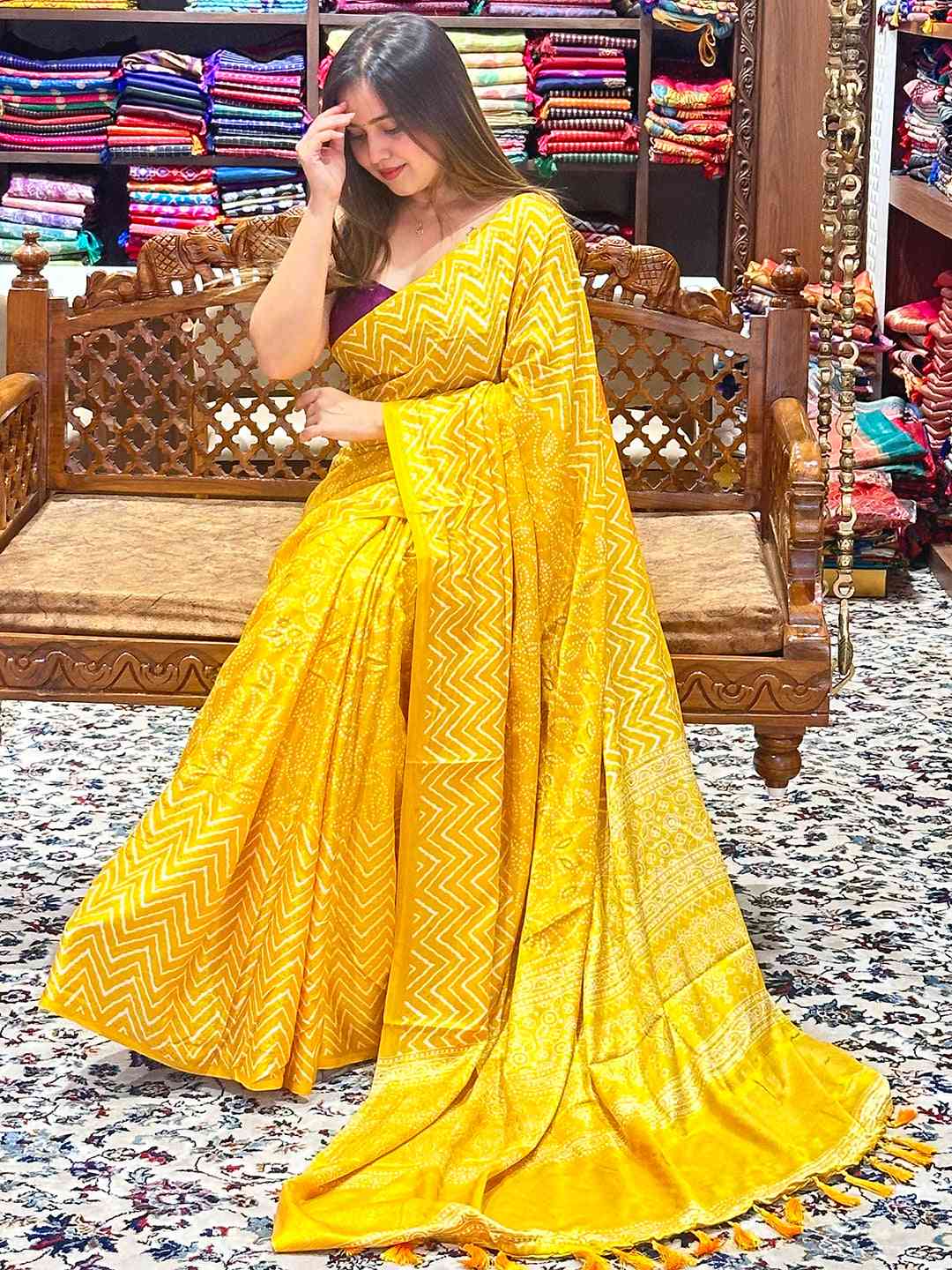 Stylish yellow Manipuri silk saree with foil print, draped elegantly.