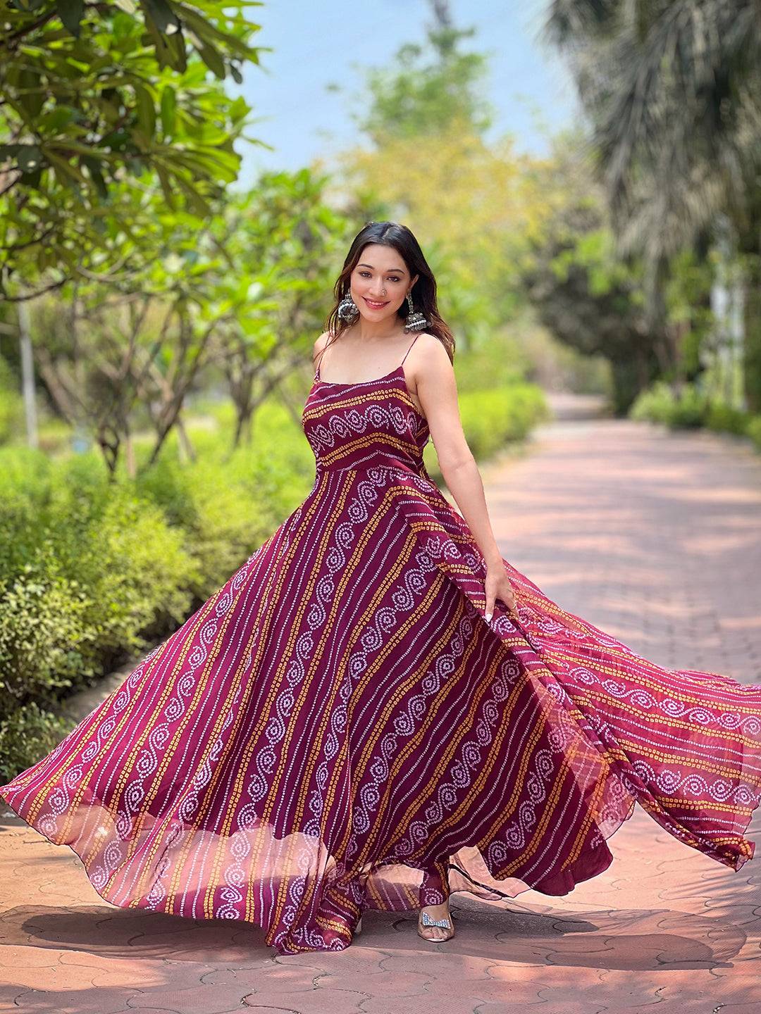Wine Bandhej Printed Dress flowing elegantly outdoors