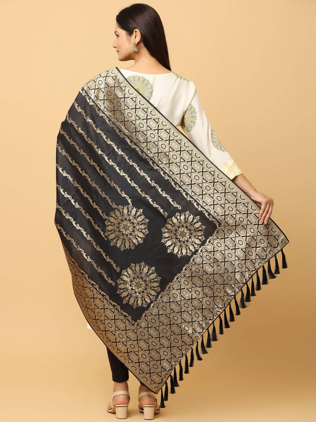 Back view of silk blend black dupatta with gold patterns